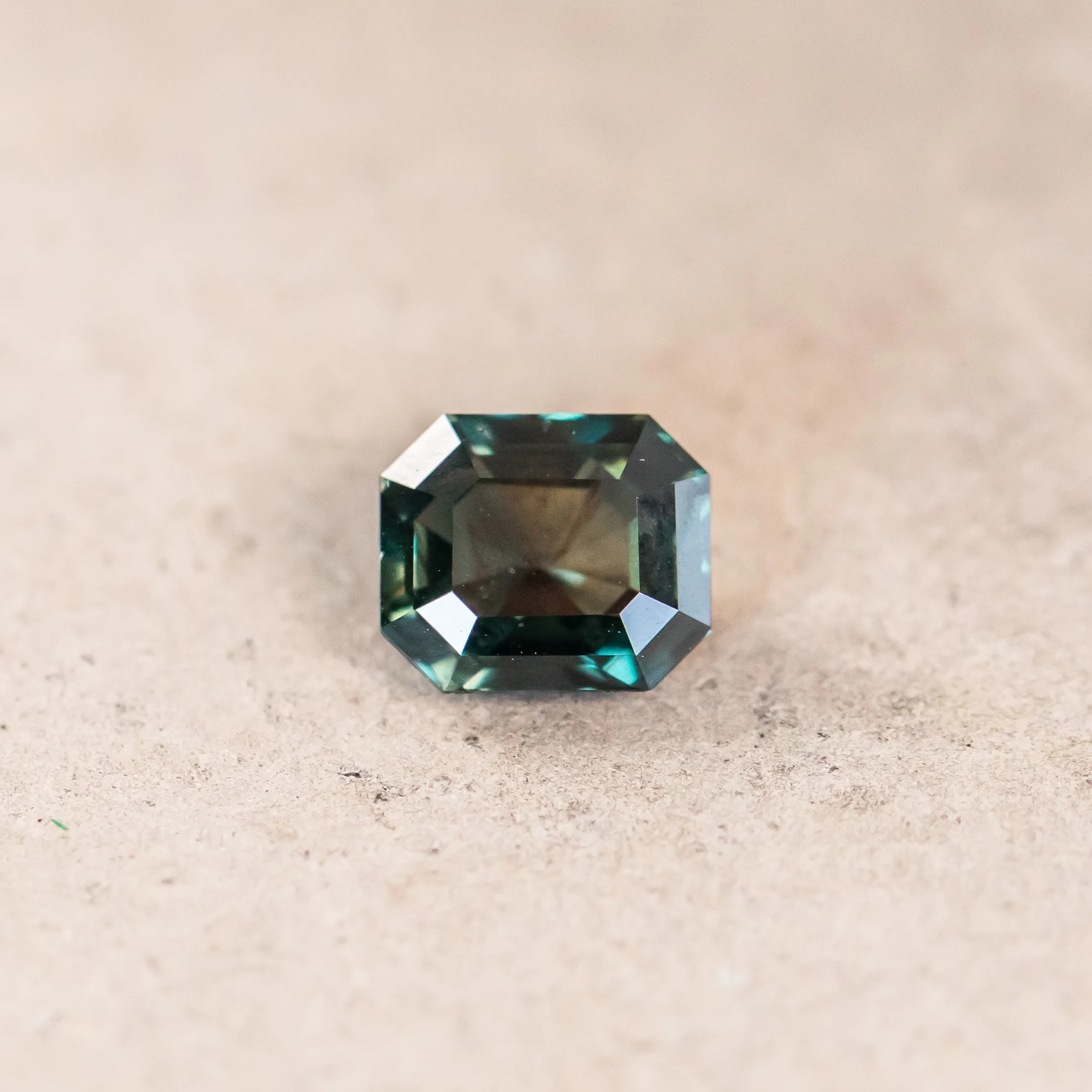 2.06CT EMERALD CUT MADAGASCAR SAPPHIRE, COLOR CHANGING DEEP TEAL TO PURPLE GREY, 7.4X6.32X4.28MM, UNTREATED