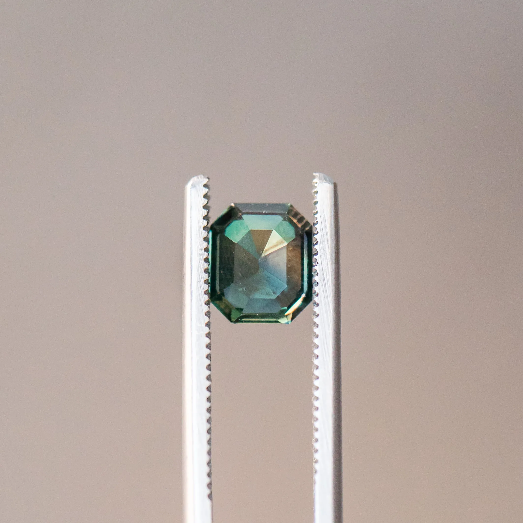 2.06CT EMERALD CUT MADAGASCAR SAPPHIRE, COLOR CHANGING DEEP TEAL TO PURPLE GREY, 7.4X6.32X4.28MM, UNTREATED