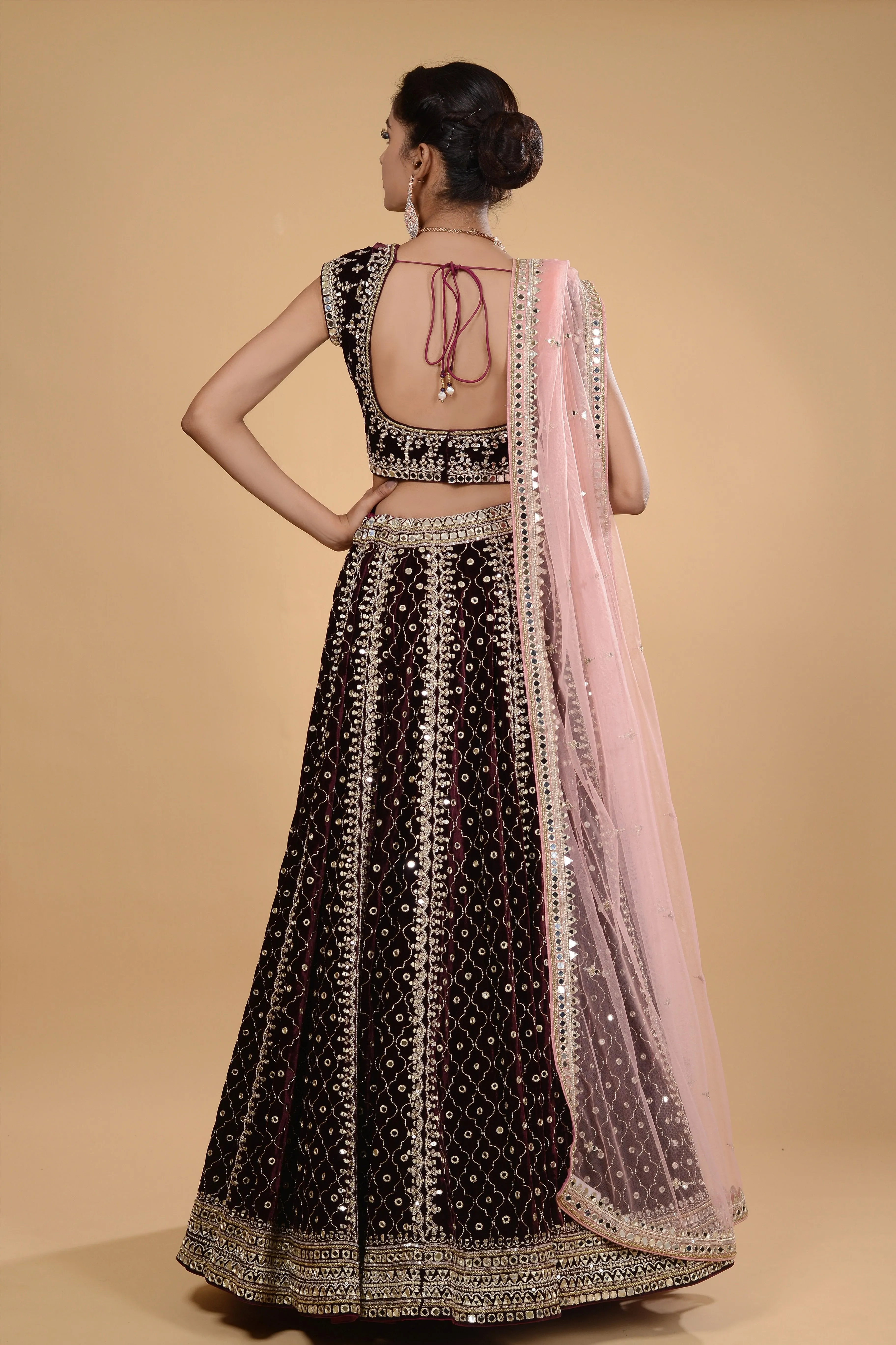 Wine and pink velvet lehenga set.