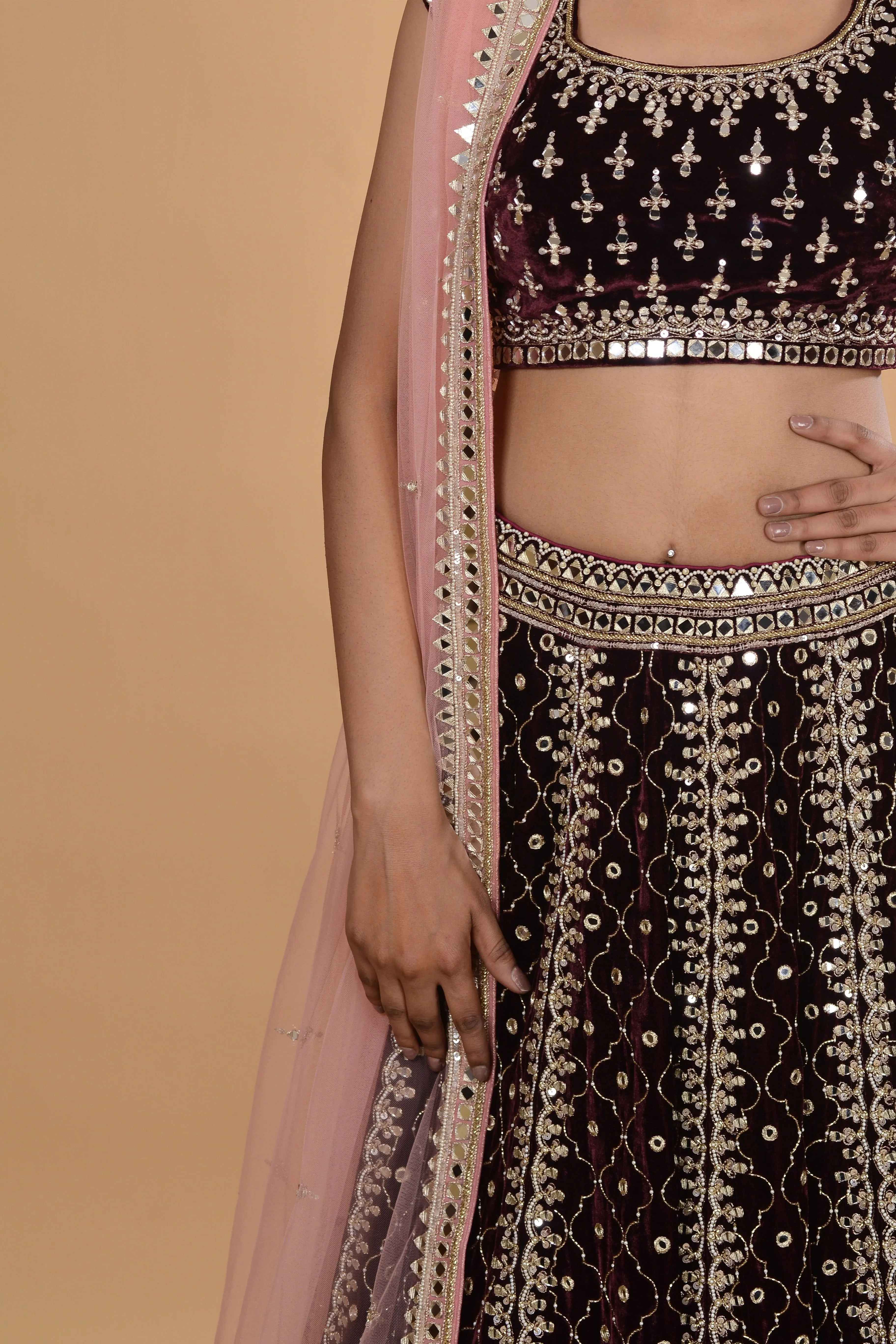 Wine and pink velvet lehenga set.